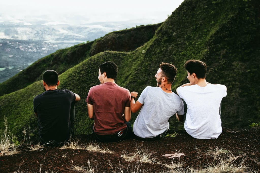 Group of friends taking a break while hiking