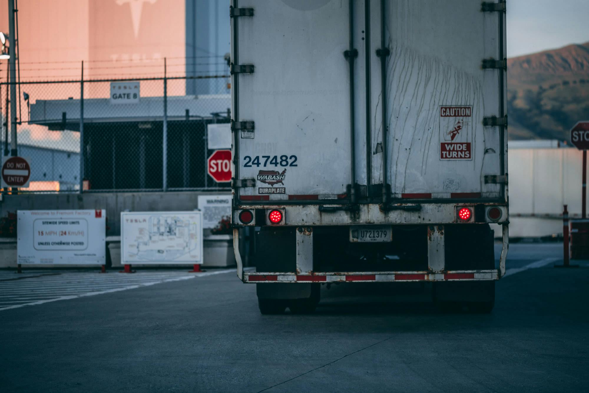 Back of a white freight truck on road