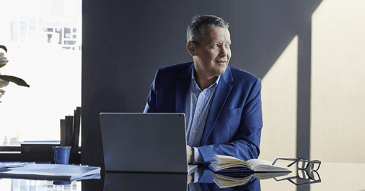 Person in office using laptop